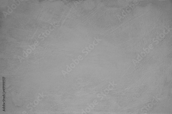 Fototapeta Dark gray scratched background. Old worn wall. Vintage. Surface. Backdrop. Presentation background. 
Texture with space for text.
