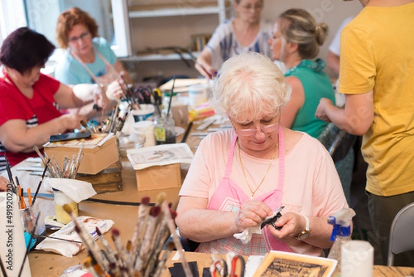 Fototapeta Women in art workshop making decoupage boxes