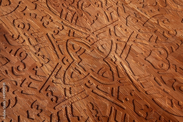 Fototapeta Wooden background or texture with carving patterns