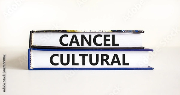Fototapeta Cancel cultural symbol. Concept words Cancel cultural on books on a beautiful white table white background. Business and cancel cultural concept, copy space.