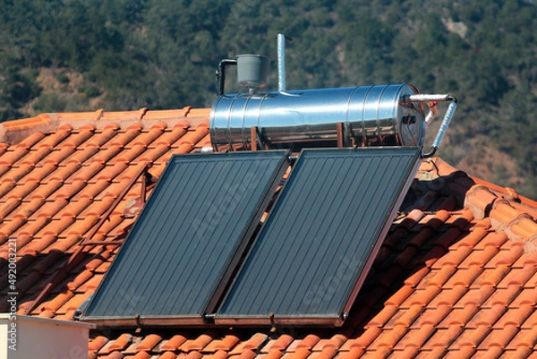 Fototapeta Solar water heating system on the rooftops