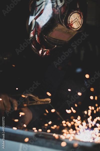 Fototapeta welder, welding automotive part in a car factory