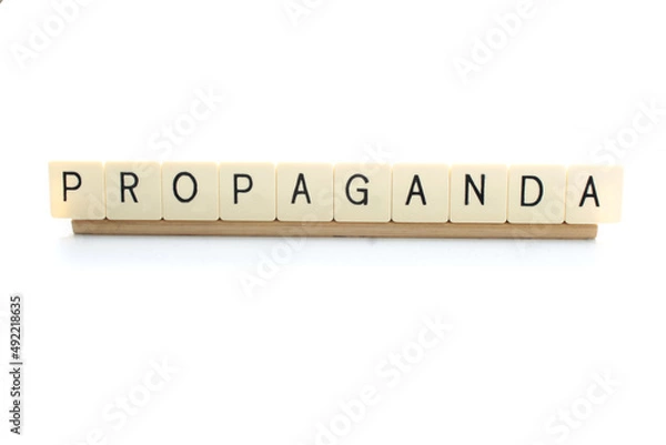 Fototapeta The word Propaganda isolated on a white background with copy space. Fake news concept