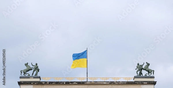 Obraz Berlin, Germany, March 4, 2022, Ukrainian flag as a sign of solidarity over the old museum.