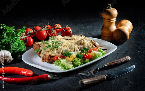 Fototapeta Delicious, fit and helathy breakfast idea. Delicious belgian waffles with egg, cheese and vegetables on dark background