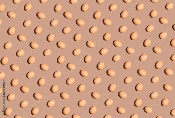 Obraz Easter egg vertical pattern composition. Spring and holiday season idea, creative celebration concept. Brown retro background.