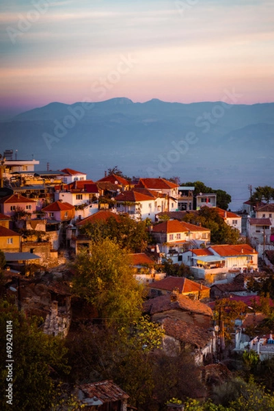 Fototapeta sunset over the village