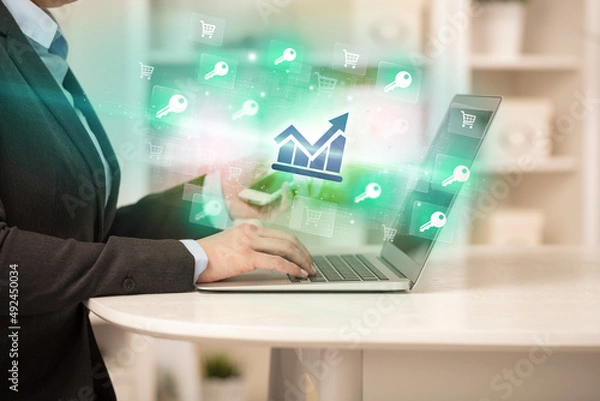 Fototapeta Businessman working on laptop with new business