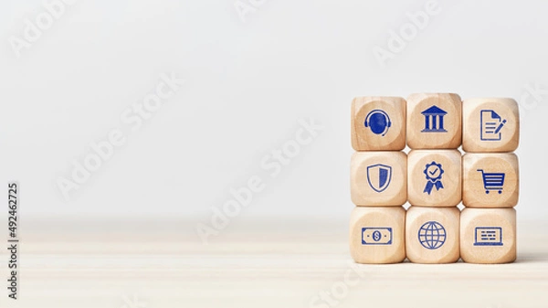 Fototapeta The concept of online banking and financial services. Cubes with business icons with copy space