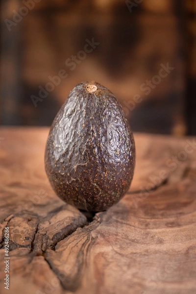 Obraz Ripe avocado isolated on wooden background 