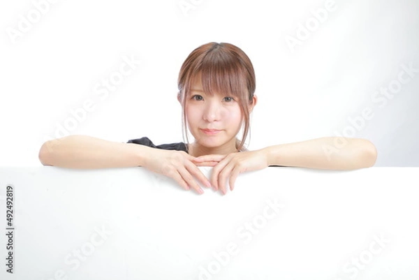 Obraz ボードを指さす女性