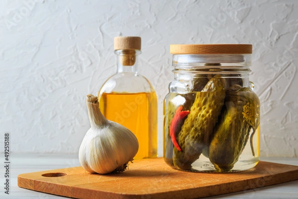Fototapeta Pickled cucumbers in a jar.