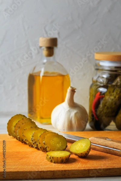 Fototapeta Pickled cucumbers in a jar.