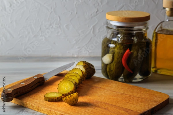 Fototapeta Pickled cucumbers in a jar.