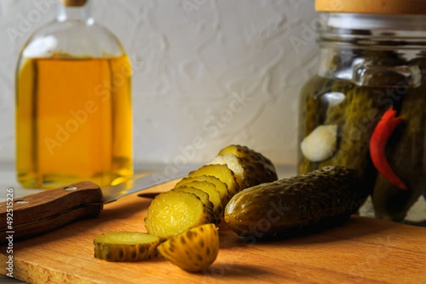 Fototapeta Pickled cucumbers in a jar.