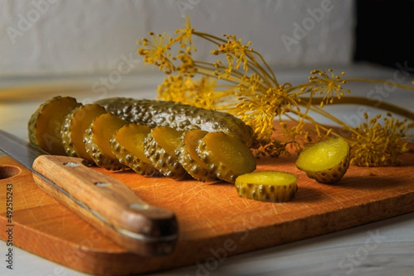 Fototapeta Pickled cucumbers in a jar.