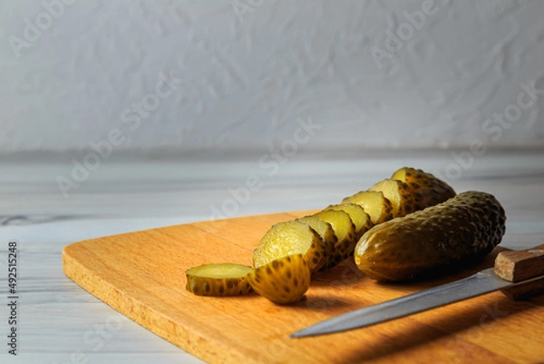 Fototapeta Pickled cucumbers in a jar.