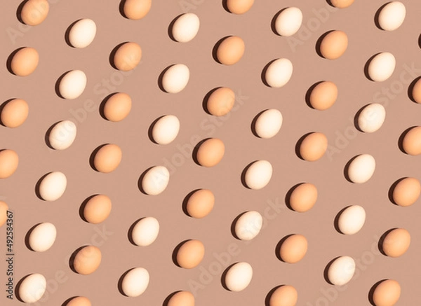 Obraz Easter egg pattern idea, spring season and holiday concept. Monochromatic brown background, retro flat lay composition.