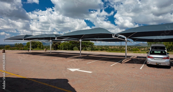 Fototapeta Car parking with awnings to create shade from the sun in Africa.