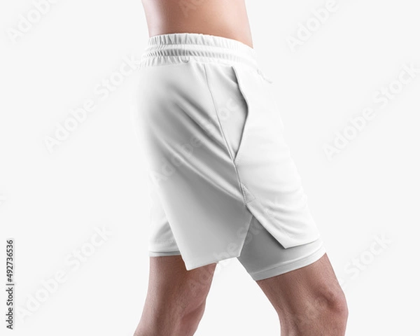 Fototapeta Mockup of white men's loose shorts with pockets, compression lining, stretch underpants, side view, isolated on background.
