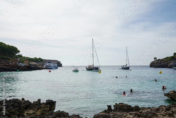 Fototapeta Cala Turqueta, Menorca. September 2021. Paradise beach on the island of Menorca. Perfect place to relax and enjoy nature in summer.