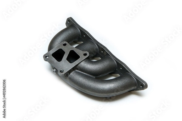 Fototapeta The new cast iron car engine air intake manifold isolated in a white background. 