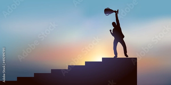 Fototapeta Concept de la réussite dans une compétition avec un homme qui brandit un trophée en haut d’un escalier après avoir gagné une course.