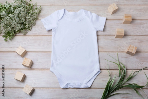 Obraz White baby short sleeve bodysuit mockup with green grass and white flowers