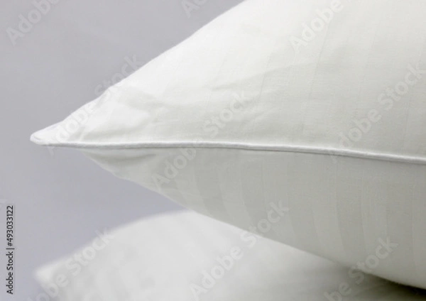 Obraz Cushion corner. White terry cotton fabric for mockup overlay design. Home textiles for the bedroom. Pillow with sewn-in piping around the edge.