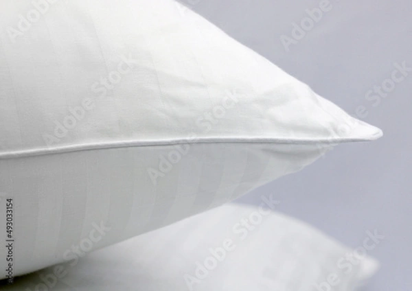 Obraz Cushion corner. White terry cotton fabric for mockup overlay design. Home textiles for the bedroom. Pillow with sewn-in piping around the edge.