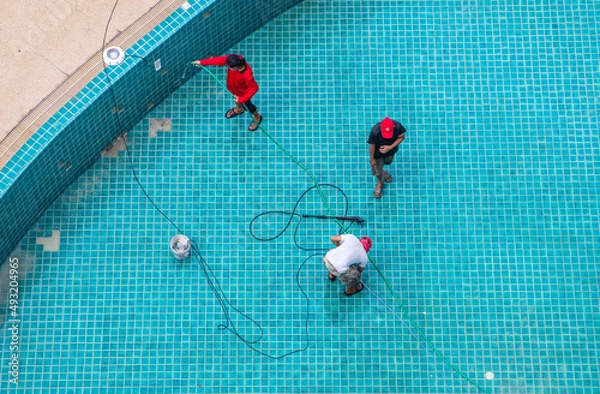 Fototapeta Renovation, maintenance, repair, and tiling work of a swimming pool	