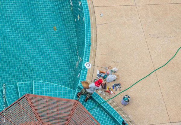 Fototapeta Renovation, maintenance, repair, and tiling work of a swimming pool	
