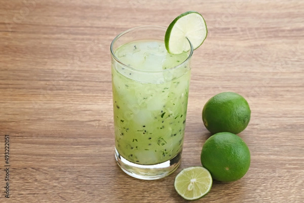 Fototapeta Es Timun Serut, a typical Indonesian drink made from shaved cucumber with syrup, lime and basil seeds. Popular during ramadan. 
