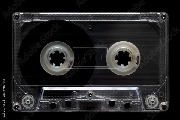 Fototapeta Old vintage audio cassette isolated on black background. Retro analog hifi music concept