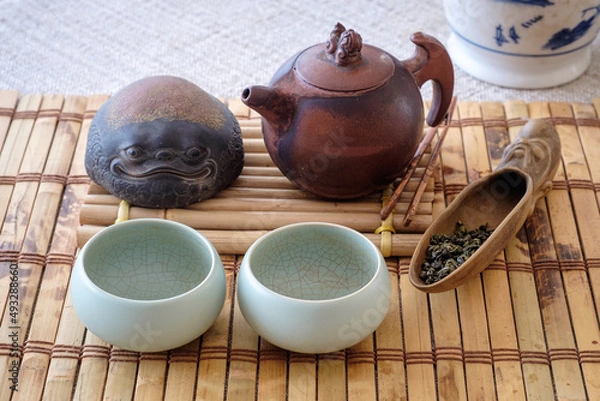 Obraz Tea set, on a wooden table of bamboo