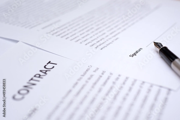 Obraz Close up of hand writing on contract 