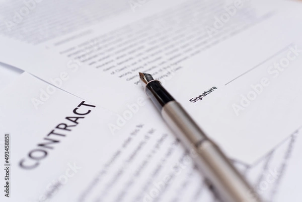 Obraz Close up of hand writing on contract 