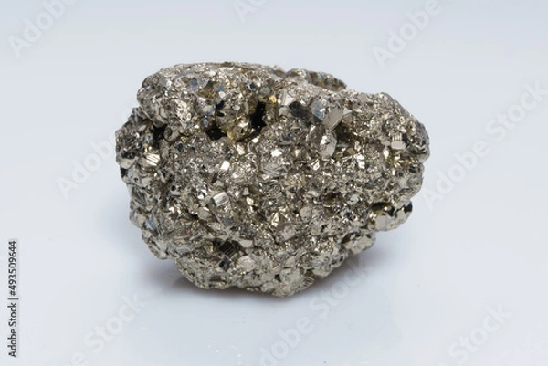 Fototapeta Raw crystalline pyrite (iron pyrite, fool's gold). Mineral pyrite from the group of sulfides. The mineral pyrite on a white background