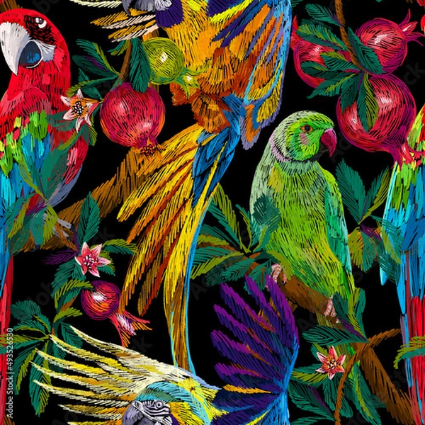 Obraz Tropical background. Exotic birds and fruits on the branches. Pomegranate tree and parrots. Colorful animals seamless pattern. Embroidery texture. Fashion design for textile, fabric and wallpaper.