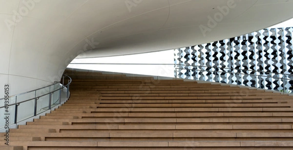 Fototapeta Exterior stairway in modern architecture using curves to create a sense of flow