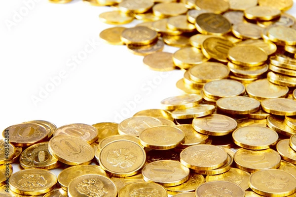 Fototapeta Pile of gold coins background on a white backgrround. Money on white background. Copy space.Finance