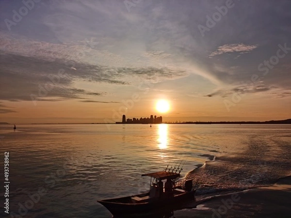 Obraz Returning boat during sunset