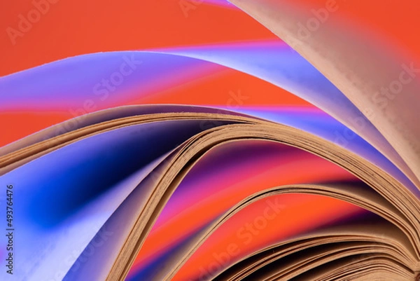 Fototapeta Open book close up macro photo. Wisdom and education concept.Love reading. Retro neon light 90s