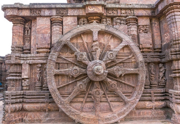 Fototapeta A stone wheel engraved in the walls of the 800 year old Sun Temple, Konark, India. The temple is designed as a chariot consisting of 24 such wheels.