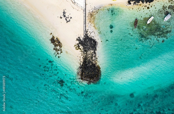 Fototapeta Aerial view of a pier located on the south east coast of Mauritius at Pointe d'Esny Beach