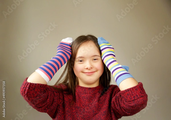 Obraz Beautiful girl smiling with different socks