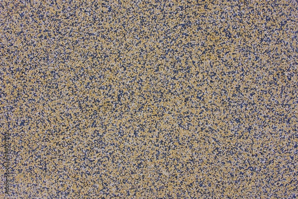 Fototapeta Interior rubber flooring material in yellow shade using in fitness ,gymnasium or playground for prevent accident. Close up of soft floor texture background.