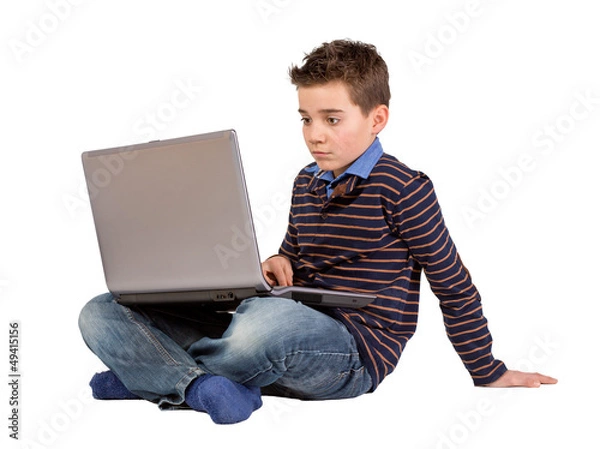 Obraz Konzentrierter Junge -  Kind mit Notebook-Laptop auf dem Schoß