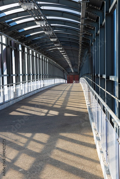 Fototapeta empty glazed overpass tunnel across the road