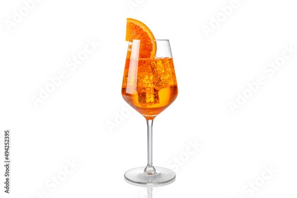 Fototapeta Alcoholic Aperol Spritz Cocktail in glass with orange slice, Isolated on White